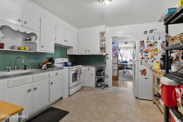1020 Raritan Ave, Highland Park, NJ 08904 - kitchen with open shelves, white appliances, a sink, white cabinetry, and light tile patterned flooring