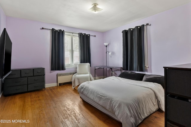 1020 Raritan Ave, Highland Park, NJ 08904 - bedroom featuring radiator heating unit, wood finished floors, and baseboards
