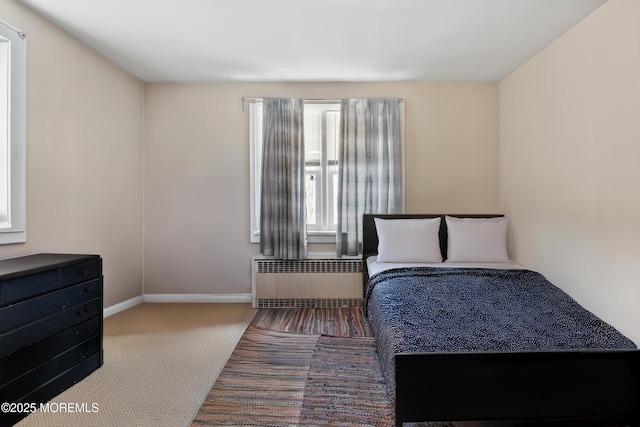1020 Raritan Ave, Highland Park, NJ 08904 - bedroom with radiator heating unit, carpet, and baseboards
