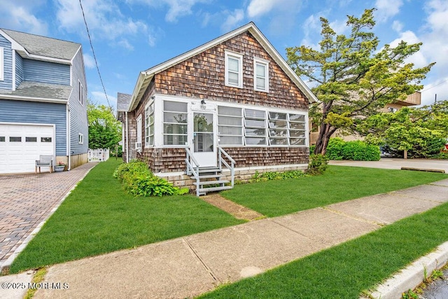 110 2nd Ave, Seaside Park, NJ 08752 - view of front of house featuring a front yard, entry steps, and driveway