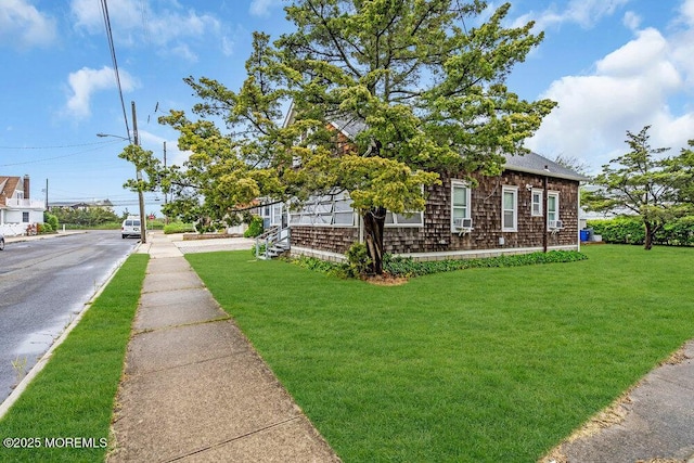 110 2nd Ave, Seaside Park, NJ 08752 - view of front of home featuring a front lawn and roof with shingles