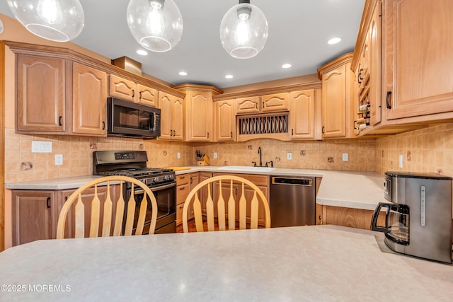50 Darien Rd, Howell, NJ 07731 - kitchen with stainless steel appliances, a sink, light countertops, backsplash, and recessed lighting