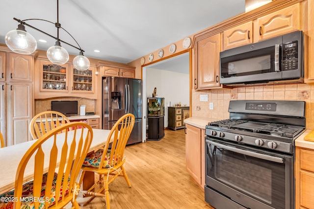 50 Darien Rd, Howell, NJ 07731 - kitchen with appliances with stainless steel finishes, light countertops, decorative backsplash, light wood finished floors, and recessed lighting
