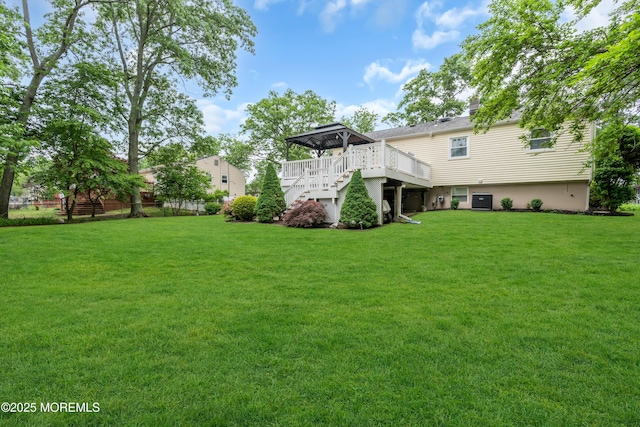 50 Darien Rd, Howell, NJ 07731 - view of grassy yard with stairway, a deck, and central AC