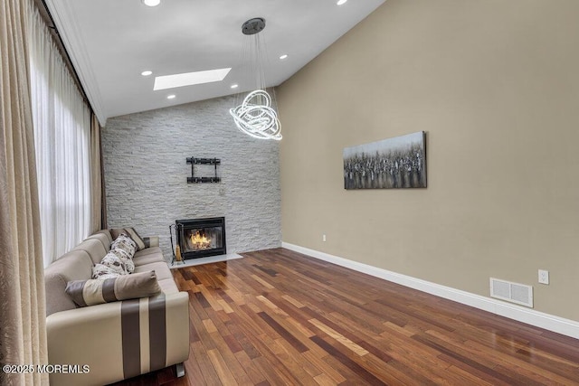 43 Saint Johns Dr, Freehold, NJ 07728 - living room featuring a fireplace, baseboards, a skylight, wood finished floors, and recessed lighting