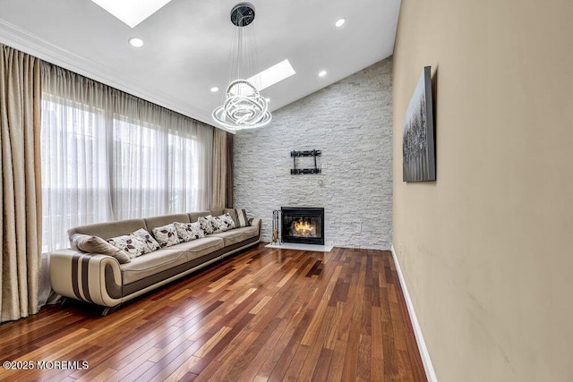 43 Saint Johns Dr, Freehold, NJ 07728 - living area with a skylight, hardwood / wood-style flooring, lofted ceiling, a fireplace, and recessed lighting
