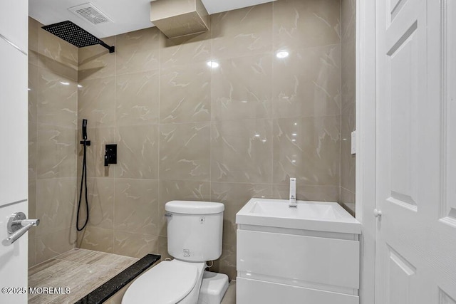 43 Saint Johns Dr, Freehold, NJ 07728 - full bathroom featuring tiled shower, toilet, tile walls, and vanity