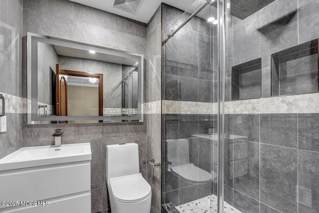 43 Saint Johns Dr, Freehold, NJ 07728 - bathroom featuring toilet, vanity, tile walls, and a stall shower
