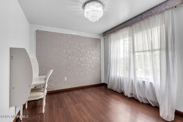 43 Saint Johns Dr, Freehold, NJ 07728 - unfurnished office featuring wallpapered walls, a chandelier, wood finished floors, and baseboards