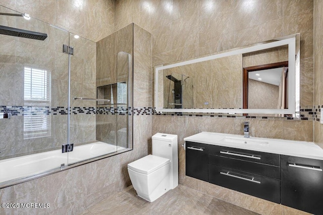 43 Saint Johns Dr, Freehold, NJ 07728 - full bathroom featuring tile walls, tiled shower / bath combo, vanity, and toilet