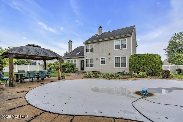 43 Saint Johns Dr, Freehold, NJ 07728 - rear view of property with a gazebo, a patio area, and a chimney