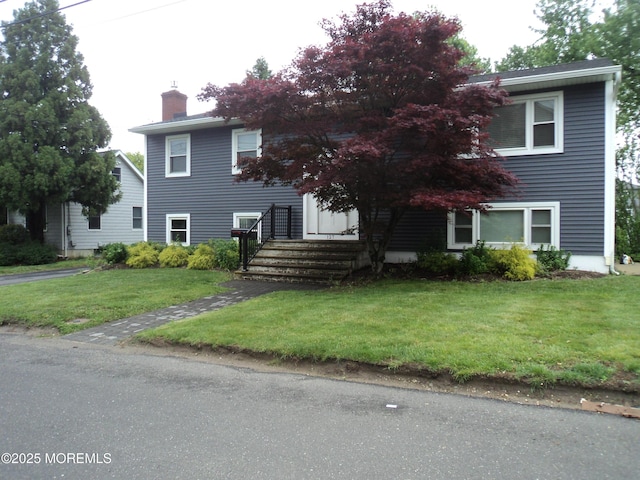 127 Hulick St, Long Branch, NJ 07740 - view of front of house with a chimney and a front yard