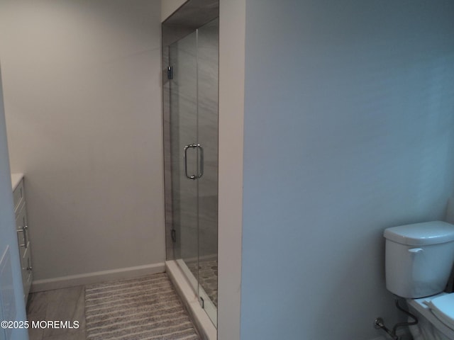 127 Hulick St, Long Branch, NJ 07740 - full bathroom featuring a stall shower, vanity, toilet, and baseboards