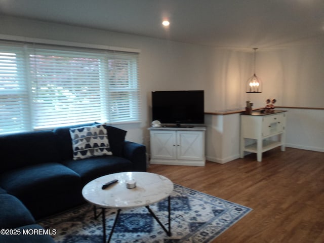 127 Hulick St, Long Branch, NJ 07740 - living room with wood finished floors, baseboards, and a chandelier