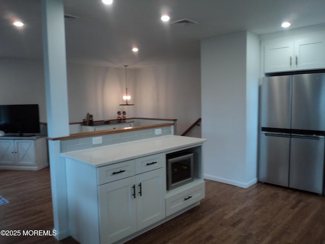 127 Hulick St, Long Branch, NJ 07740 - kitchen with freestanding refrigerator, white cabinets, dark wood-style floors, light countertops, and recessed lighting