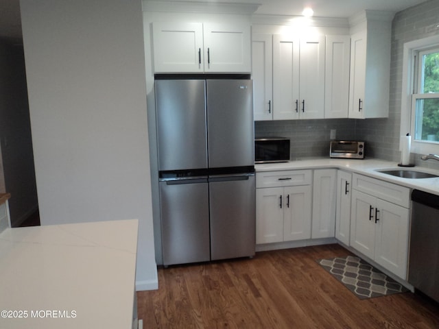 127 Hulick St, Long Branch, NJ 07740 - kitchen featuring appliances with stainless steel finishes, a sink, dark wood finished floors, and light countertops