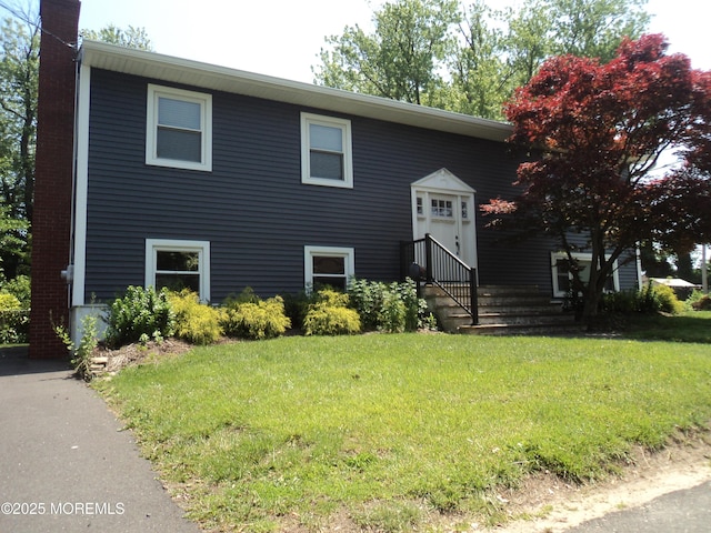 127 Hulick St, Long Branch, NJ 07740 - split foyer home with a chimney and a front lawn