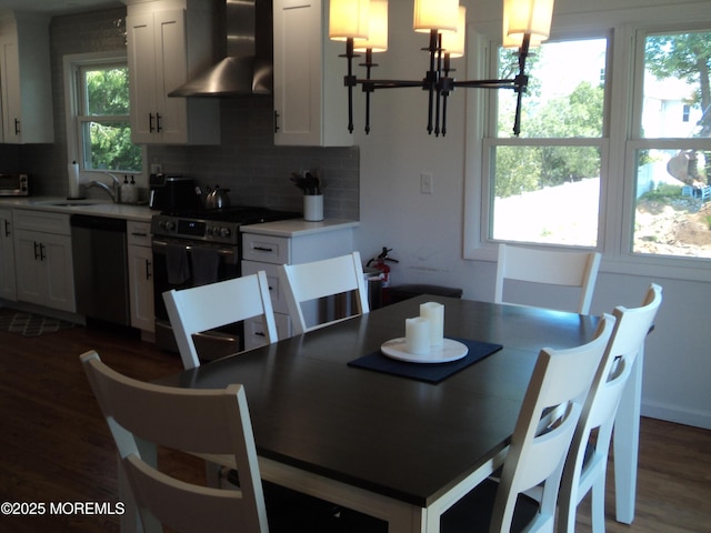 127 Hulick St, Long Branch, NJ 07740 - dining room featuring dark wood finished floors and a chandelier