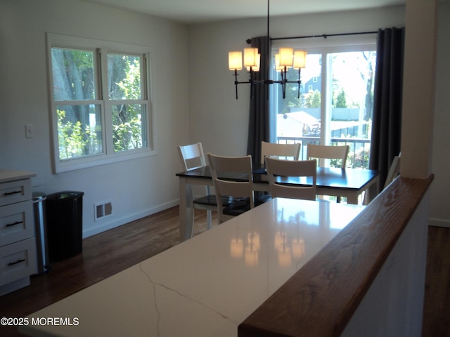 127 Hulick St, Long Branch, NJ 07740 - dining area with plenty of natural light, a chandelier, dark wood-style floors, and baseboards