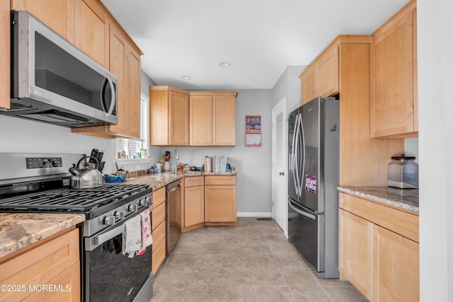 1204 River Rd, Belmar, NJ 07719 - kitchen featuring appliances with stainless steel finishes, light brown cabinetry, light stone counters, and baseboards