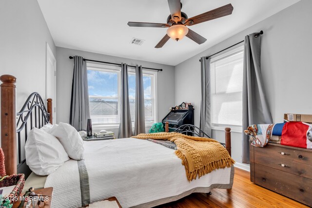 1204 River Rd, Belmar, NJ 07719 - bedroom featuring wood finished floors, a ceiling fan, and baseboards