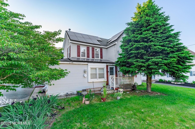 830 Atlantic City Blvd, Bayville, NJ 08721 - view of front of home with roof mounted solar panels and a front yard