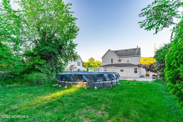 830 Atlantic City Blvd, Bayville, NJ 08721 - view of grassy yard with a covered pool and a patio area