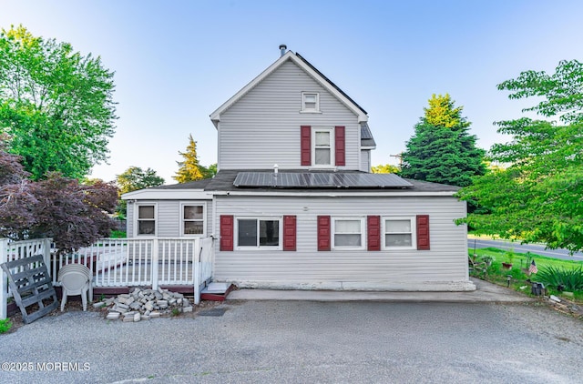 830 Atlantic City Blvd, Bayville, NJ 08721 - traditional home featuring solar panels and a wooden deck