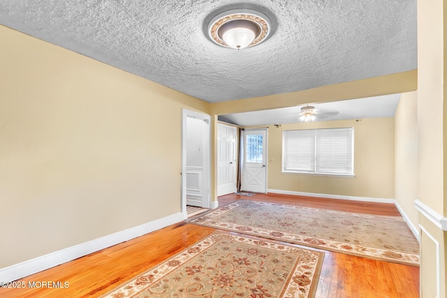 830 Atlantic City Blvd, Bayville, NJ 08721 - entrance foyer featuring wood finished floors, baseboards, a textured ceiling, and ceiling fan
