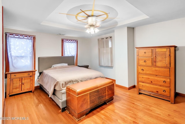 830 Atlantic City Blvd, Bayville, NJ 08721 - bedroom with a raised ceiling, light wood finished floors, and baseboards