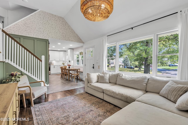 17 Maplewood Dr, Middletown, NJ 07748 - living area featuring stairs, high vaulted ceiling, dark wood finished floors, and a chandelier