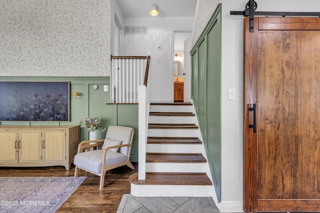 17 Maplewood Dr, Middletown, NJ 07748 - staircase with wallpapered walls, wood finished floors, and a wainscoted wall