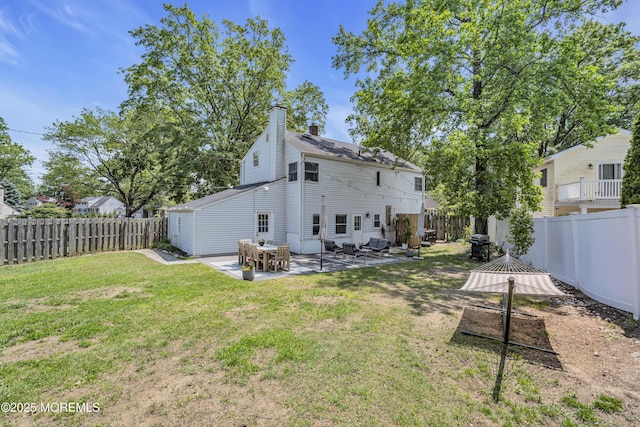 17 Maplewood Dr, Middletown, NJ 07748 - back of property with a patio area and a chimney