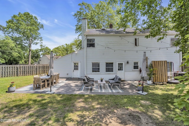 17 Maplewood Dr, Middletown, NJ 07748 - rear view of property featuring a chimney and a patio area