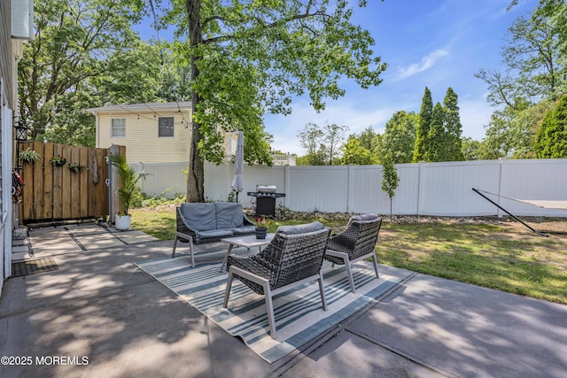 17 Maplewood Dr, Middletown, NJ 07748 - fenced backyard featuring an outdoor hangout area, a patio area, and a grill