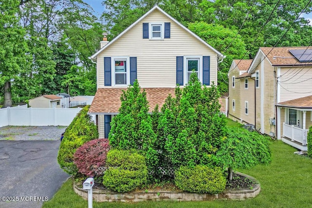 908 Green Grove Rd, Ocean Twp, NJ 07712 - view of front of home featuring a chimney, central AC unit, and driveway