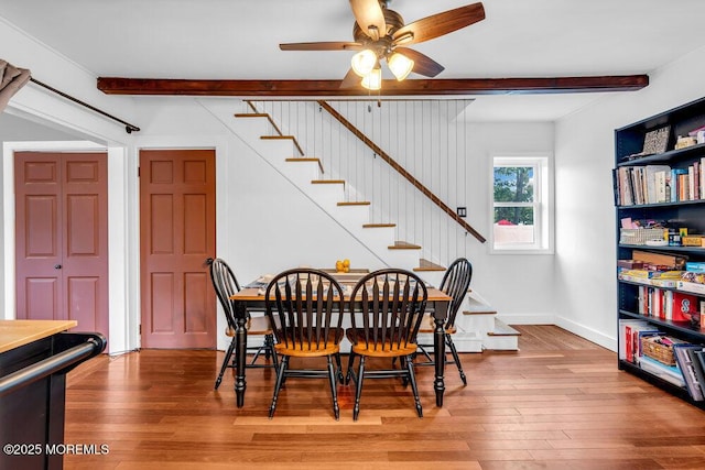908 Green Grove Rd, Ocean Twp, NJ 07712 - dining space featuring beam ceiling, stairs, a ceiling fan, hardwood / wood-style flooring, and baseboards