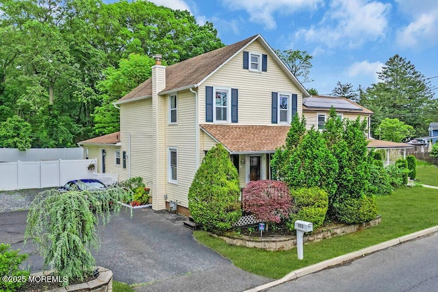 908 Green Grove Rd, Ocean Twp, NJ 07712 - traditional home with a chimney, roof with shingles, and asphalt driveway