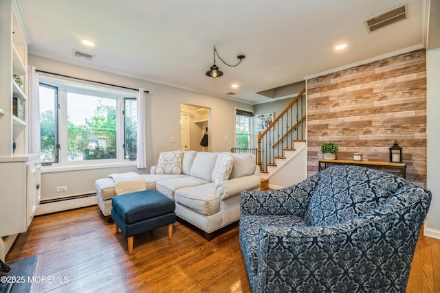 13 Poplar Ave, Fair Haven, NJ 07704 - living area featuring a baseboard heating unit, wood walls, wood finished floors, stairway, and ornamental molding