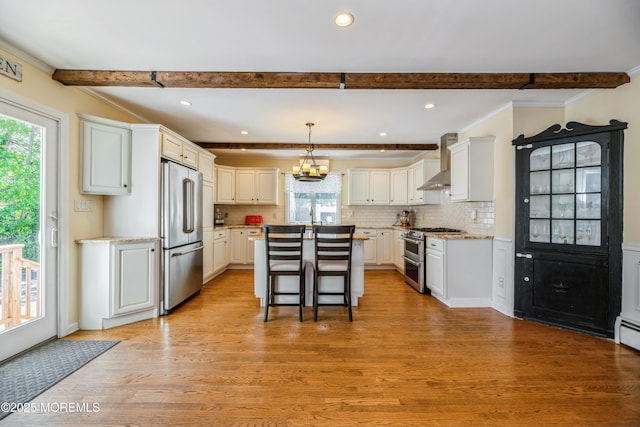 13 Poplar Ave, Fair Haven, NJ 07704 - kitchen with stainless steel appliances, beamed ceiling, healthy amount of natural light, wall chimney range hood, and light wood-type flooring