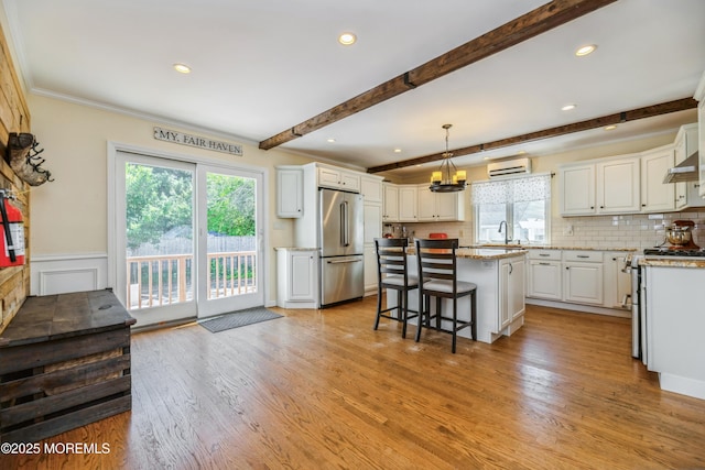 13 Poplar Ave, Fair Haven, NJ 07704 - kitchen with stainless steel appliances, an AC wall unit, plenty of natural light, a breakfast bar area, and beamed ceiling