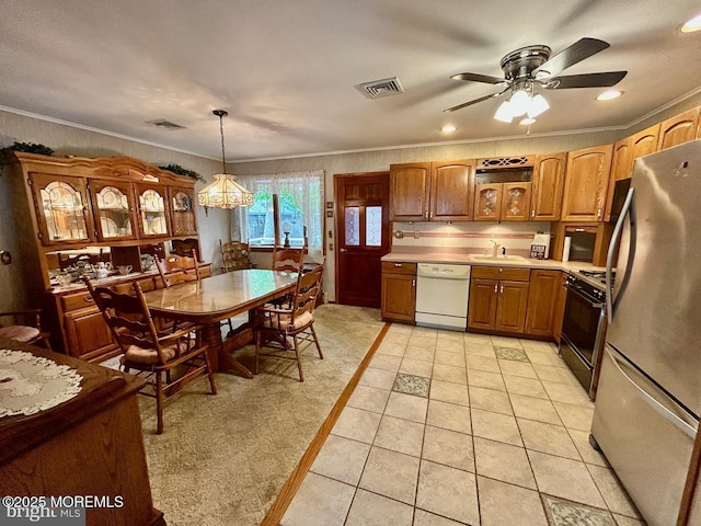 504 Windsor St, Forked River, NJ 08731 - kitchen featuring freestanding refrigerator, dishwasher, gas range oven, a ceiling fan, and brown cabinets