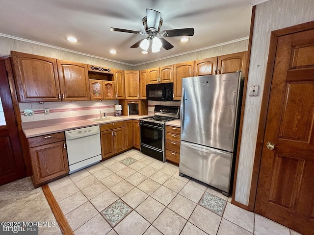 504 Windsor St, Forked River, NJ 08731 - kitchen featuring black appliances, a sink, light countertops, ornamental molding, and a ceiling fan