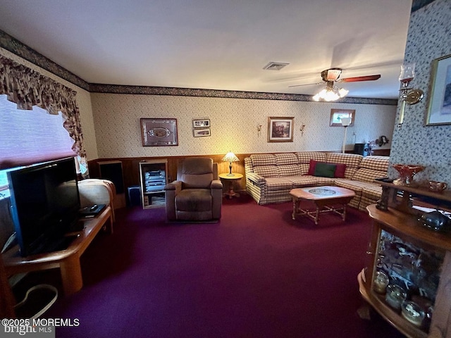 504 Windsor St, Forked River, NJ 08731 - carpeted living room with wallpapered walls, a ceiling fan, wainscoting, and a desk