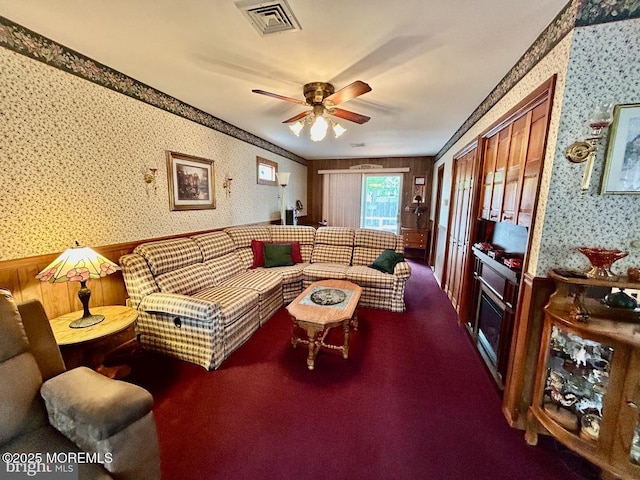504 Windsor St, Forked River, NJ 08731 - living room with wallpapered walls, a wainscoted wall, and ceiling fan