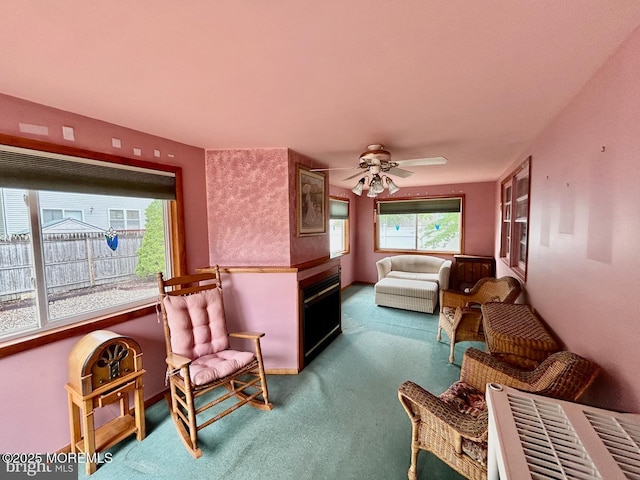 504 Windsor St, Forked River, NJ 08731 - carpeted living area featuring ceiling fan and a fireplace