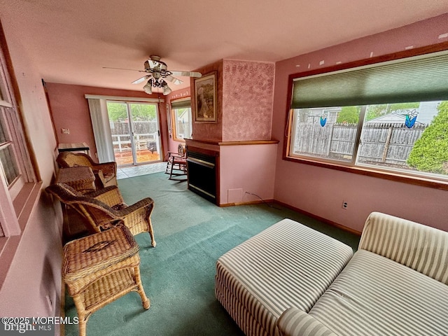 504 Windsor St, Forked River, NJ 08731 - living area with carpet floors, a ceiling fan, and a fireplace