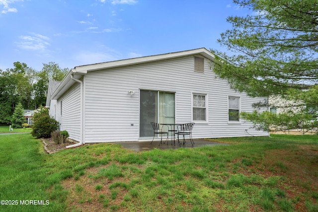 4 Olympus Way, Brick, NJ 08724 - rear view of house with a lawn and a patio