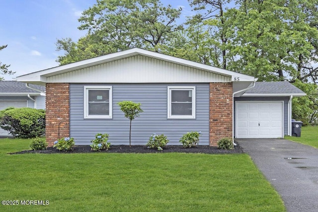 85 Central Blvd, Brick, NJ 08724 - view of front facade featuring a front lawn, an attached garage, and driveway