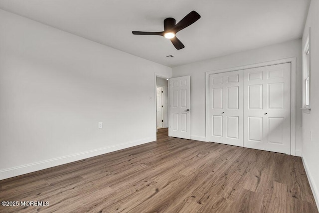 85 Central Blvd, Brick, NJ 08724 - unfurnished bedroom with wood finished floors, baseboards, a closet, and a ceiling fan